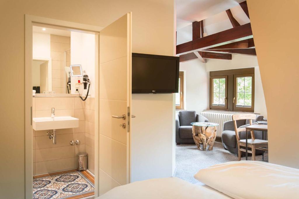 Ein Bett oder Betten in einem Zimmer der Unterkunft Hotel Deutschherrenhof