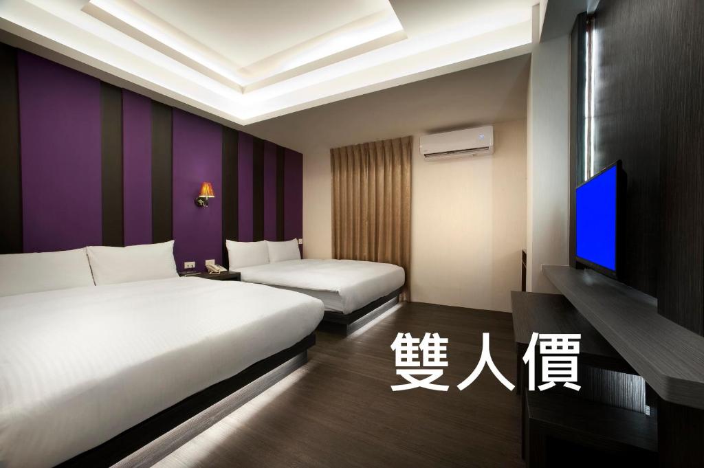 TV a/nebo společenská místnost v ubytování Two Fukun Hotel