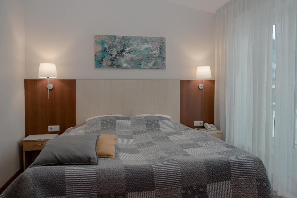 Postel nebo postele na pokoji v ubytování Hotel Edvards