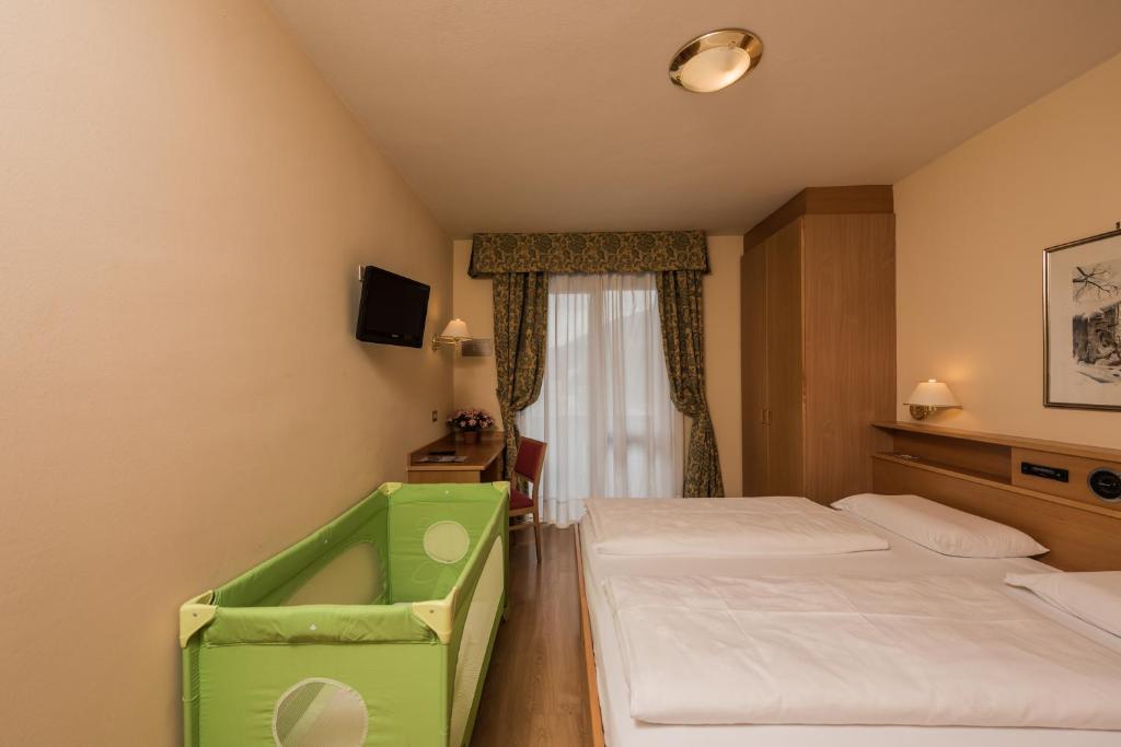 Postel nebo postele na pokoji v ubytování Hotel Union