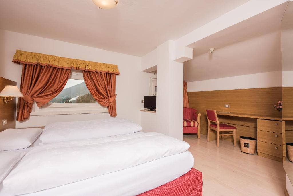 Postel nebo postele na pokoji v ubytování Hotel Union