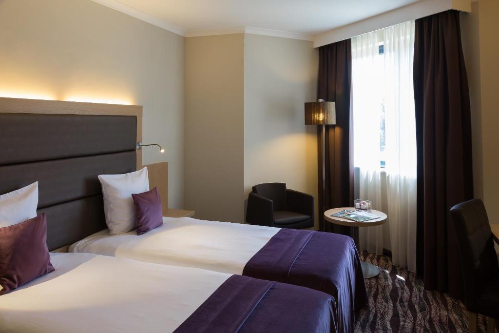 Postel nebo postele na pokoji v ubytování Hotel Restaurant Van Der Valk Nivelles-Sud
