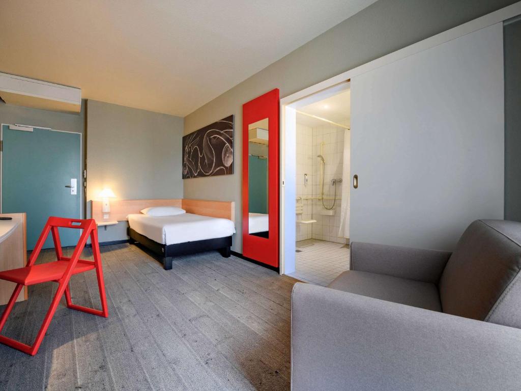 Postel nebo postele na pokoji v ubytování ibis Luebeck City