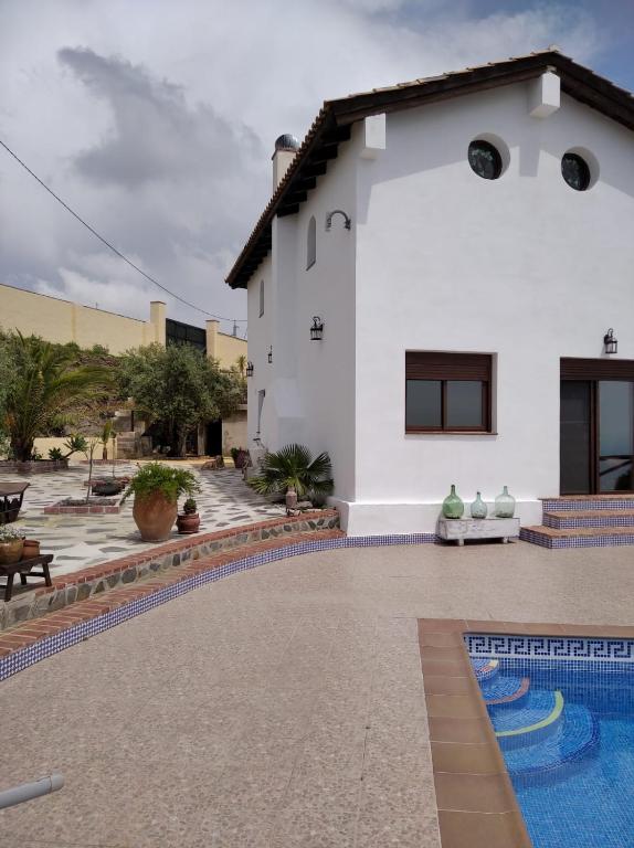 Bazén v ubytování Cortijo Mirador de Almuñecar nebo v jeho okolí