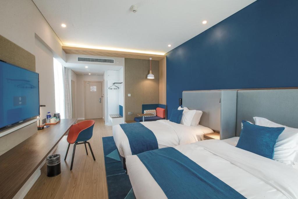 Postel nebo postele na pokoji v ubytování Holiday Inn Express Hefei High Tech by IHG