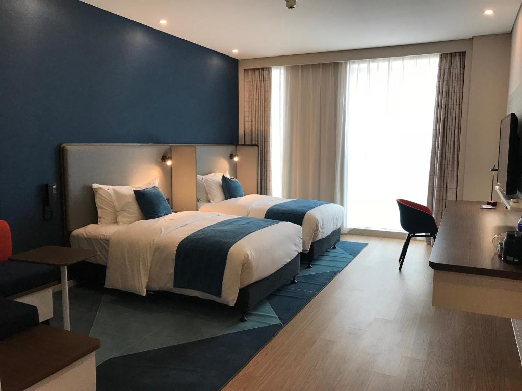 Postel nebo postele na pokoji v ubytování Holiday Inn Express Hefei High Tech by IHG
