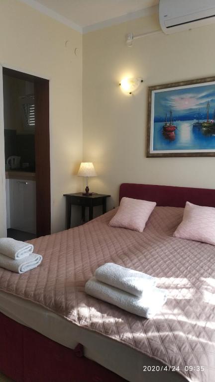 Postel nebo postele na pokoji v ubytování Diklo beach apartments Robert & Renata
