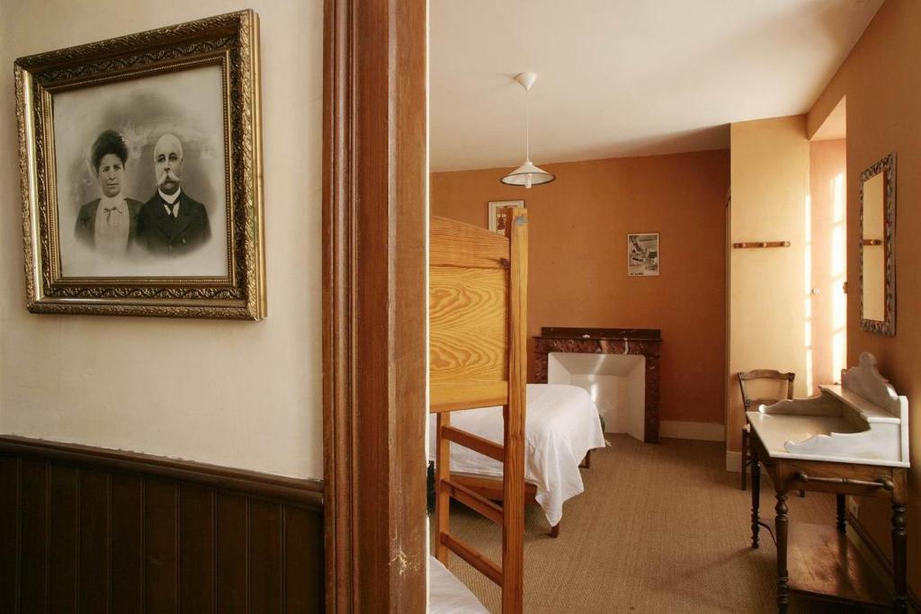 Postel nebo postele na pokoji v ubytování Le Poujastou