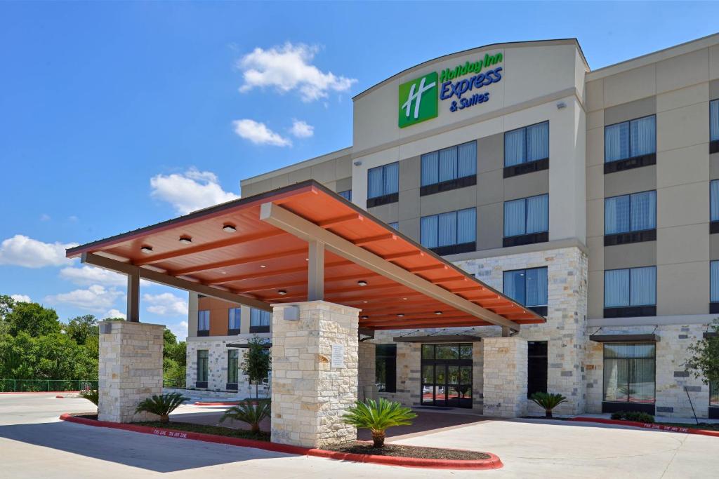 a rendering of a hotel with a large building at Holiday Inn Express & Suites Austin South, an IHG Hotel in Austin