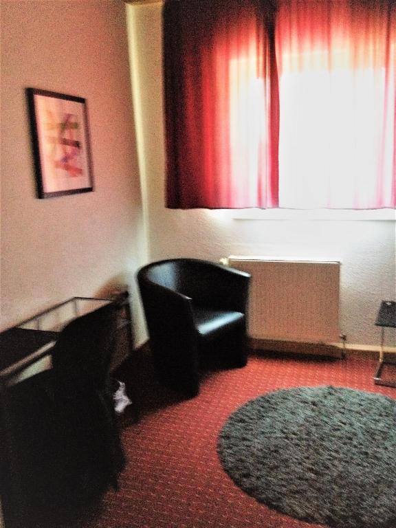 Posezení v ubytování Hotel Saarland Lebach