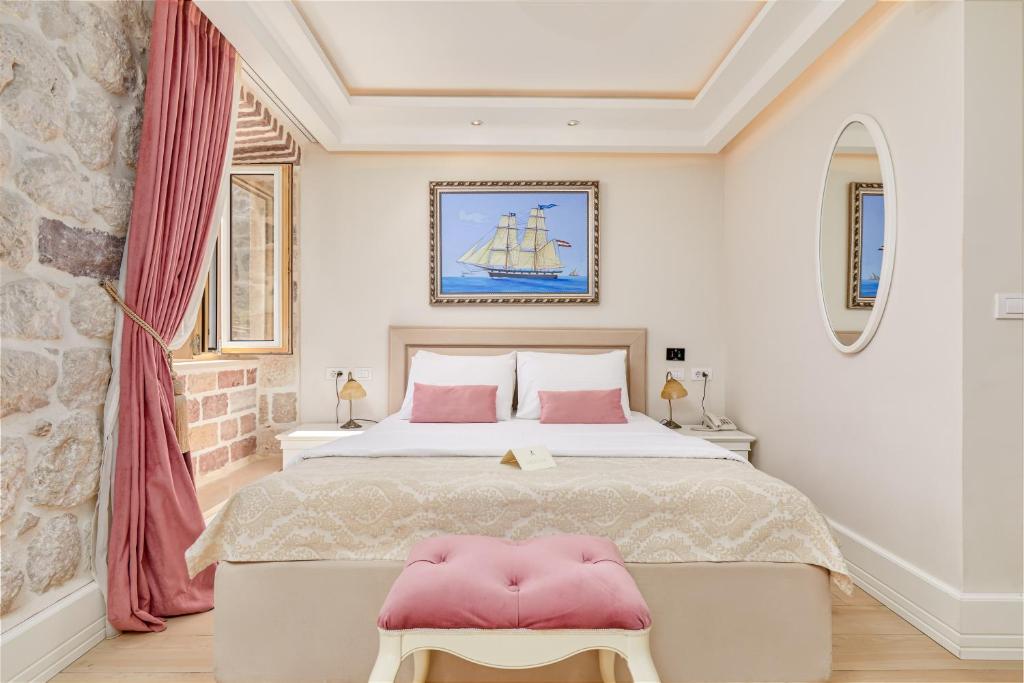 Ein Bett oder Betten in einem Zimmer der Unterkunft Hotel Libertas