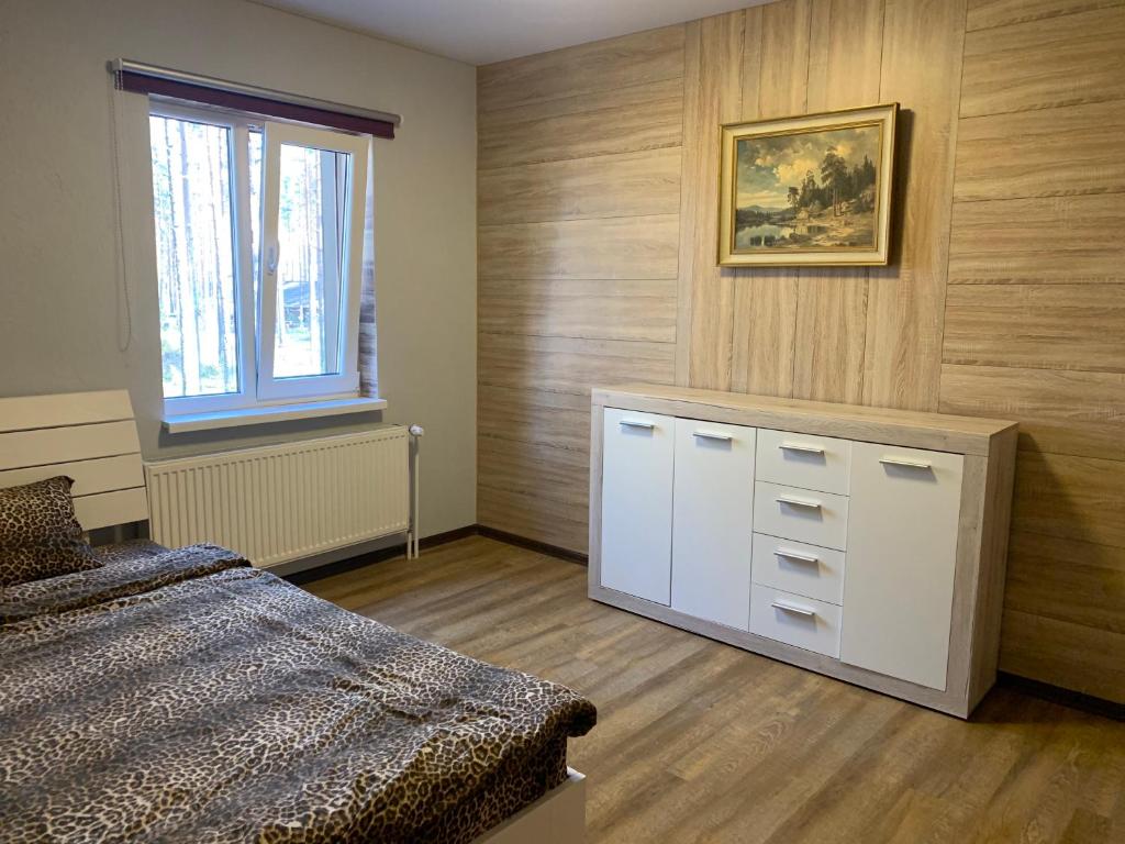 Postel nebo postele na pokoji v ubytování Kammelja Puhkemajad