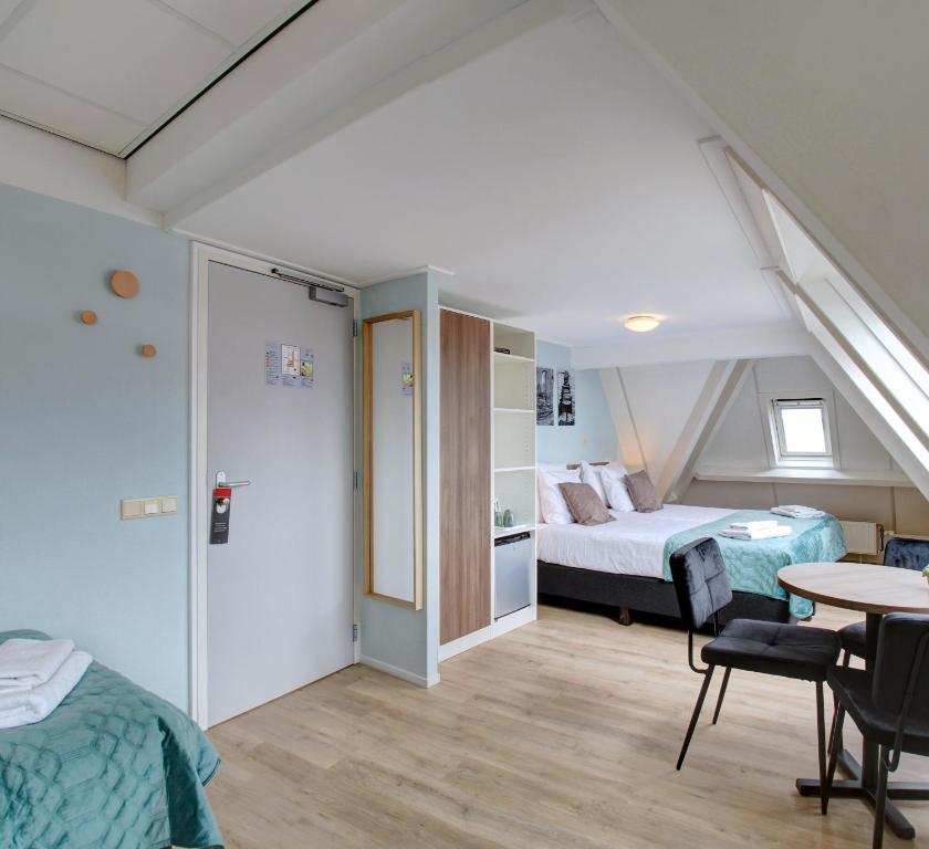 Postel nebo postele na pokoji v ubytování Hotel Duinlust