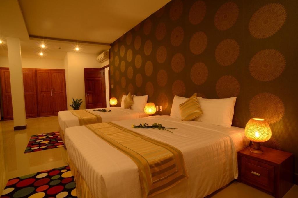 Giường trong phòng chung tại Lien Do Star Hotel