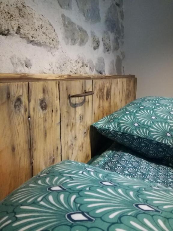 Postel nebo postele na pokoji v ubytování L'Echevine en vercors