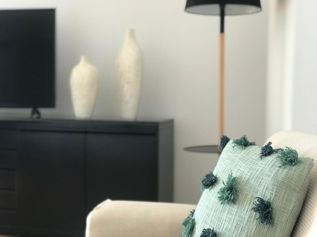 Televízia a/alebo spoločenská miestnosť v ubytovaní Lets Holidays Ancora 3