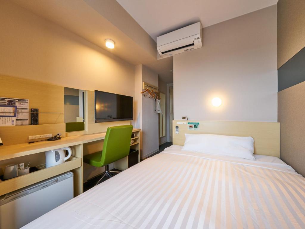 Postel nebo postele na pokoji v ubytování Super Hotel Kashima