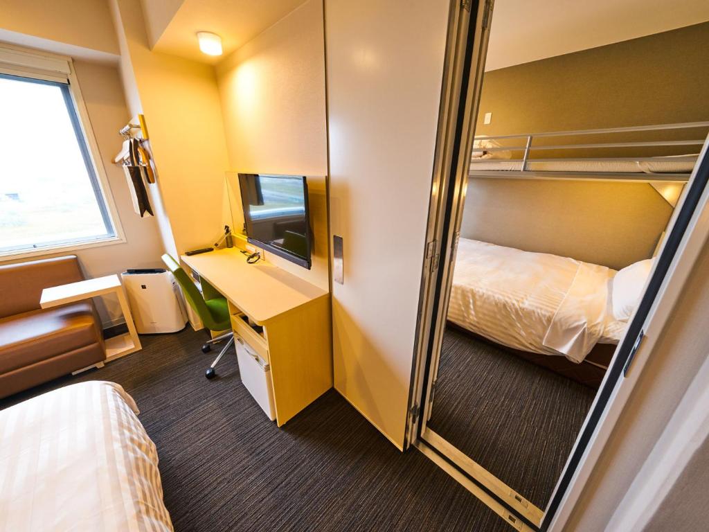 Postel nebo postele na pokoji v ubytování Super Hotel Kashima