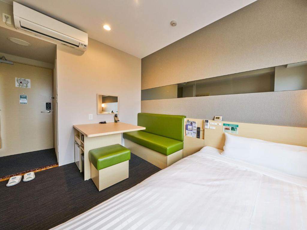 Postel nebo postele na pokoji v ubytování Super Hotel Kashima