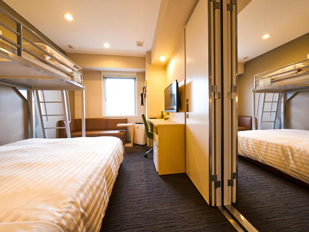 Postel nebo postele na pokoji v ubytování Super Hotel Kashima