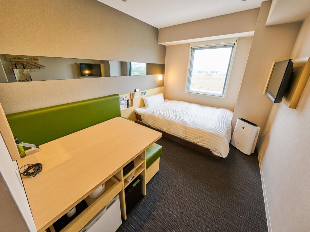 Postel nebo postele na pokoji v ubytování Super Hotel Kashima