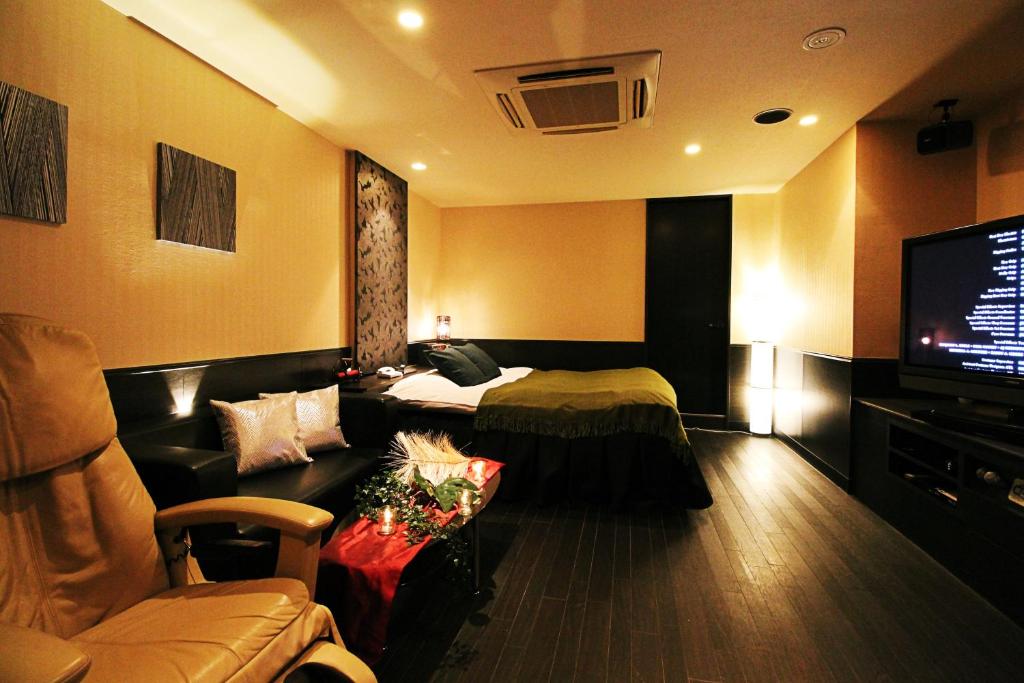 TV a/nebo společenská místnost v ubytování HOTEL O2 -Adult Only-