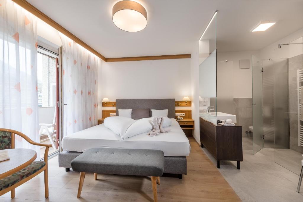 Postel nebo postele na pokoji v ubytování Hotel Wilma