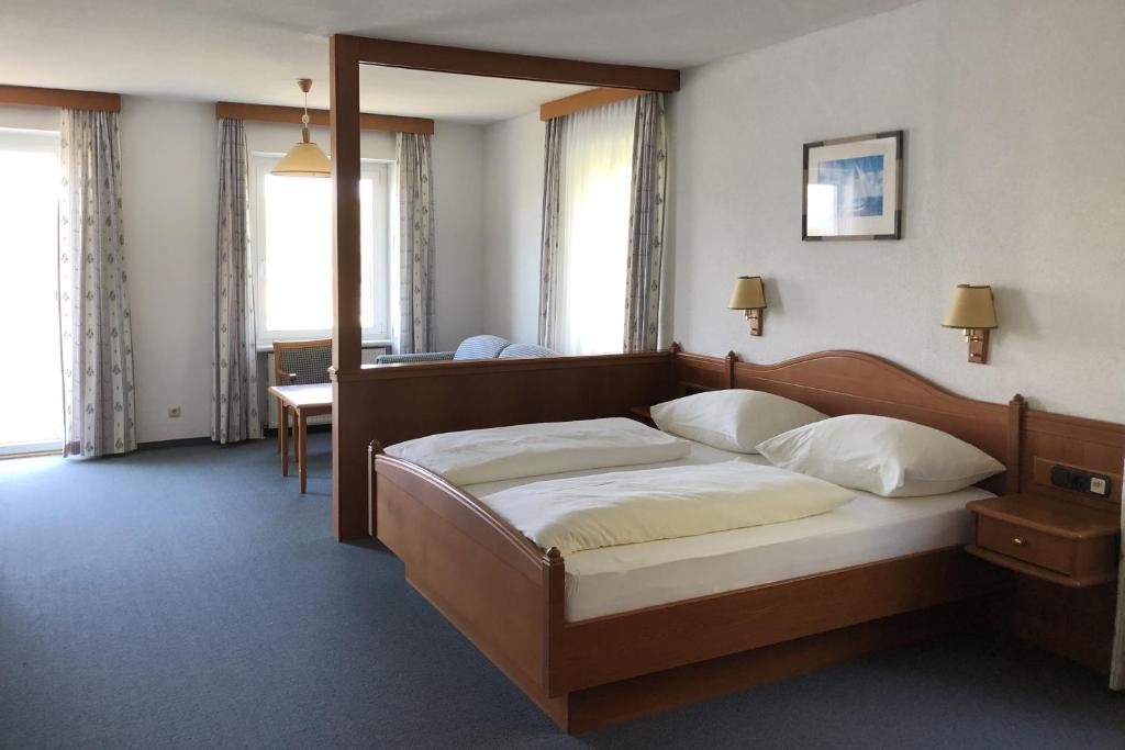 Postel nebo postele na pokoji v ubytování Hotel-Restaurant Faustschlössl