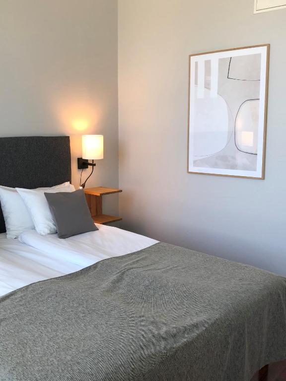 Postel nebo postele na pokoji v ubytování Grand Hotel Falkenberg