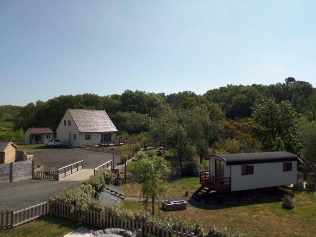 an aerial view of a house and a barn at Gîte des Garennes in Saint-Étienne-au-Mont