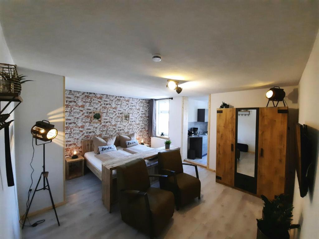 Postel nebo postele na pokoji v ubytování Apartments und Bistro Zum Glasmacher
