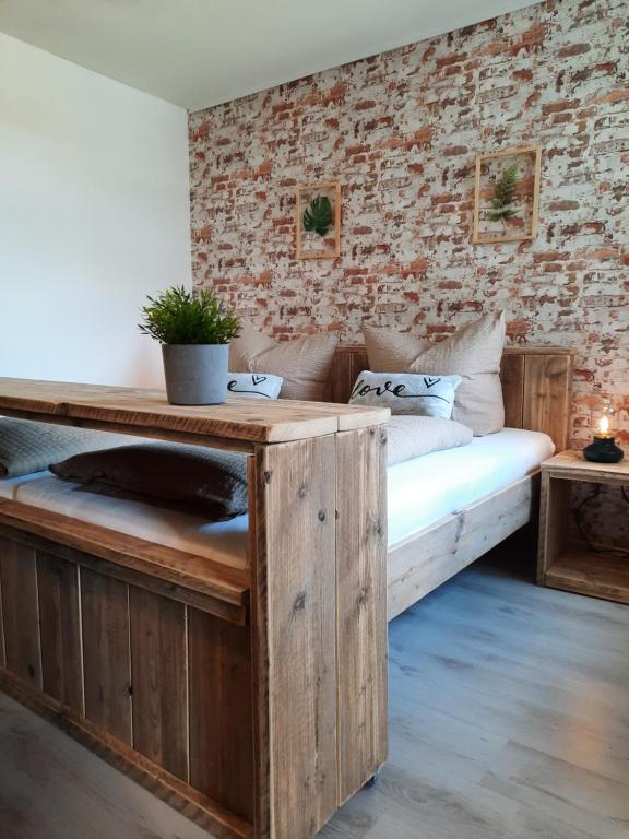 Postel nebo postele na pokoji v ubytování Apartments und Bistro Zum Glasmacher