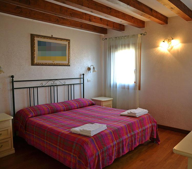 Postel nebo postele na pokoji v ubytování Oceano Mare B&B