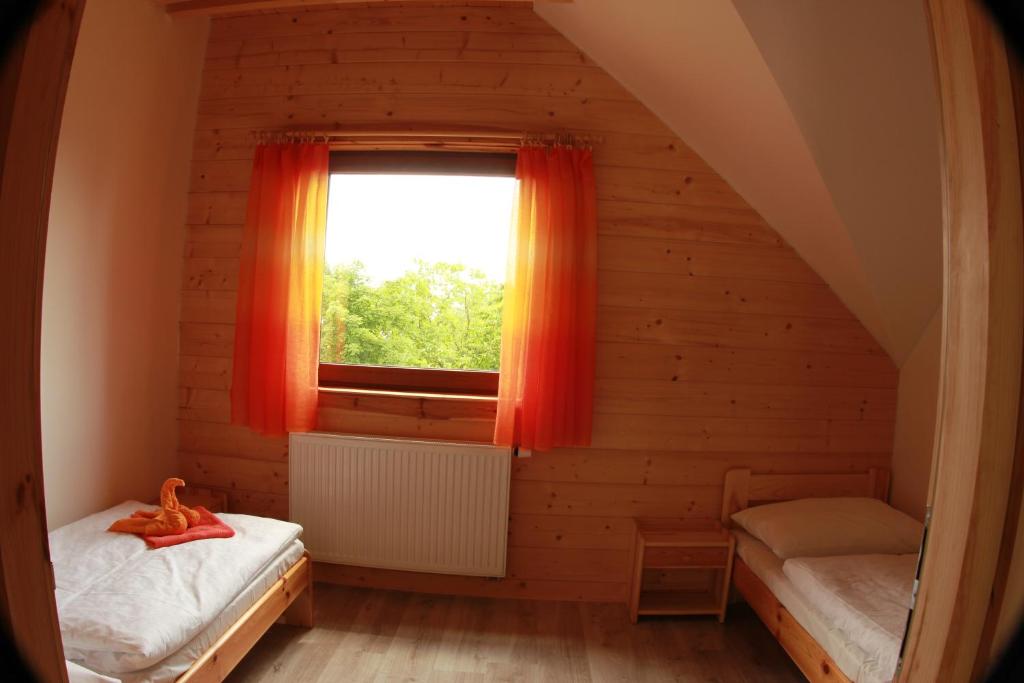 Postel nebo postele na pokoji v ubytování Vila Horček