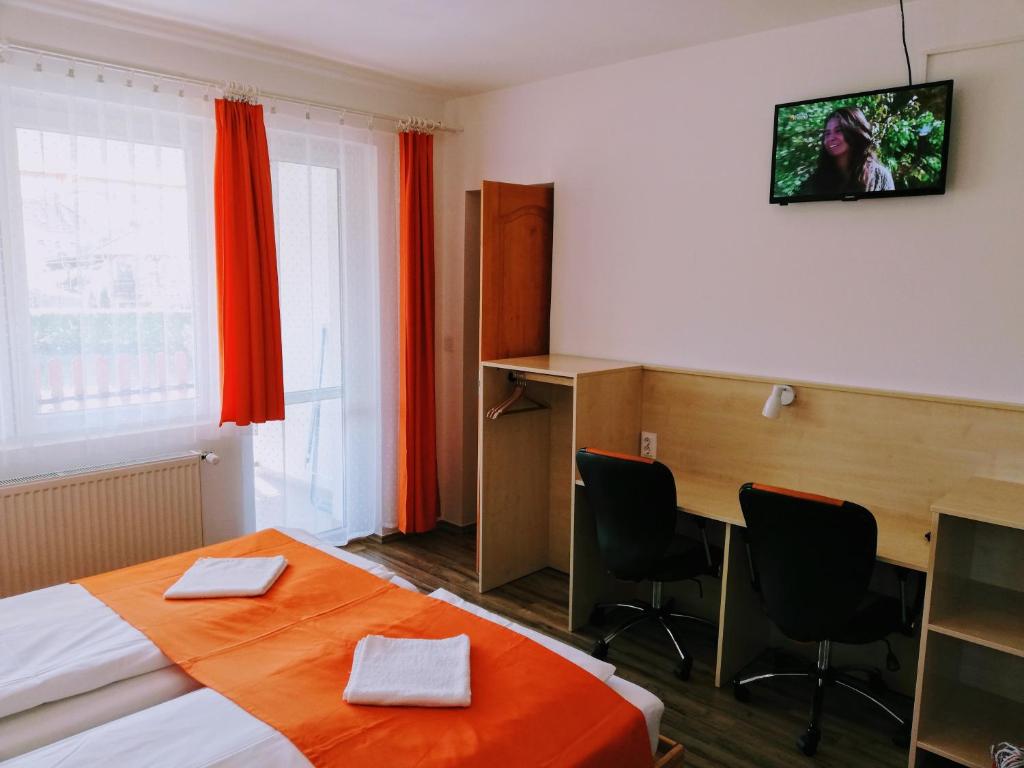 Posteľ alebo postele v izbe v ubytovaní Lótuszvirág Vendégház