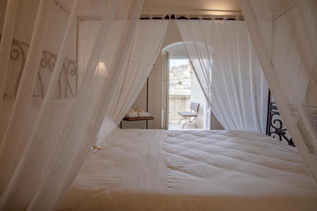 Katil atau katil-katil dalam bilik di L'Artiere Dimore nei Sassi