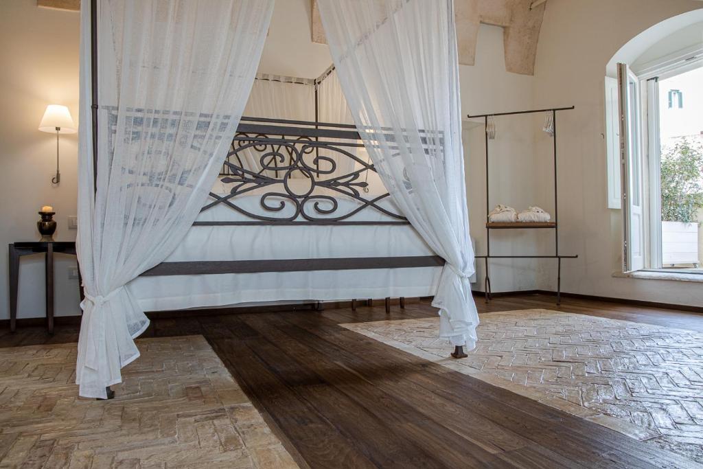 Ein Bett oder Betten in einem Zimmer der Unterkunft L'Artiere Dimore nei Sassi