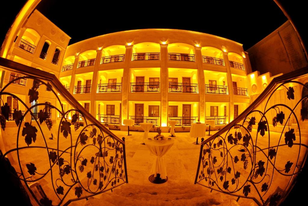 a large building with a staircase in front of it at Izala Boutique Hotel in Mardin