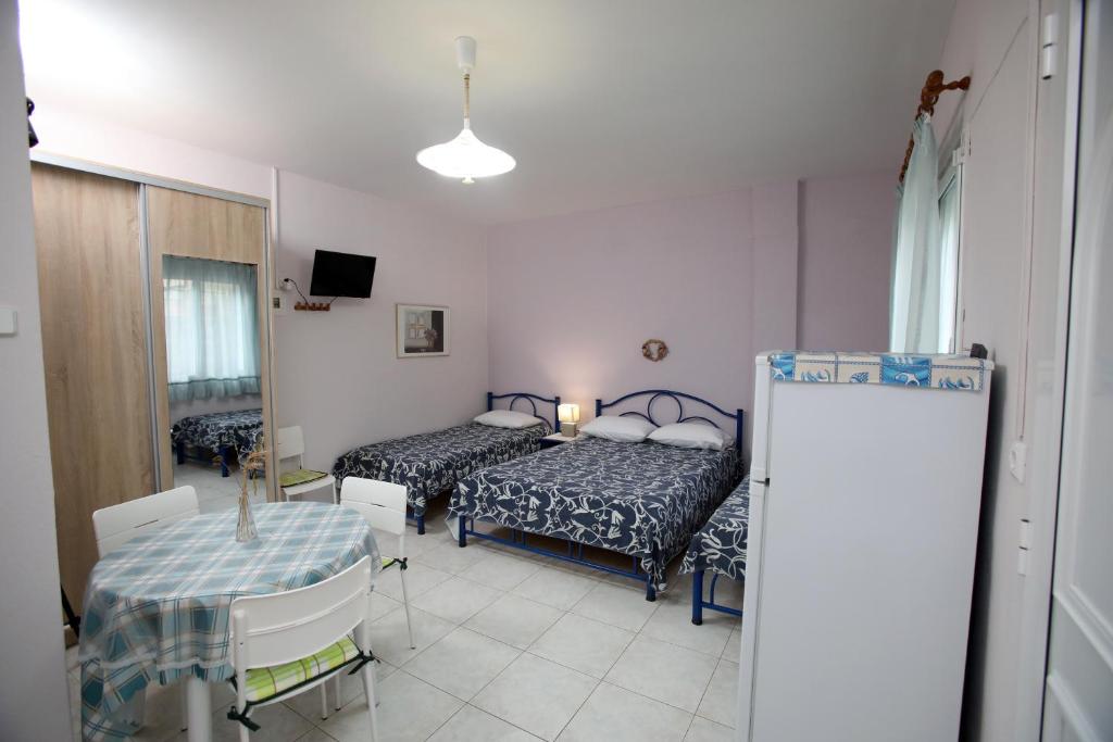 Postel nebo postele na pokoji v ubytování Pavlidis