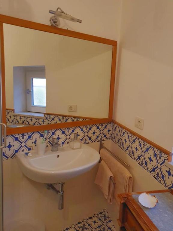 Koupelna v ubytování Casa a Mare