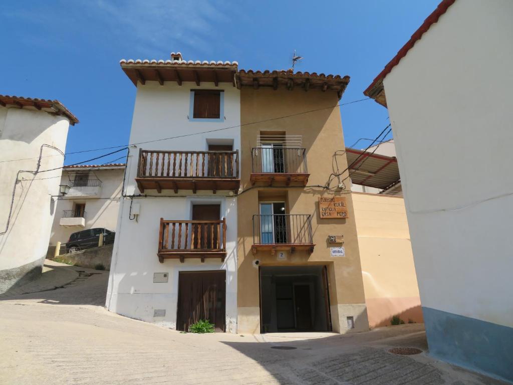 a building with balconies on the side of it at Antigua Casa Pepo y Casa Marieta in Herbés