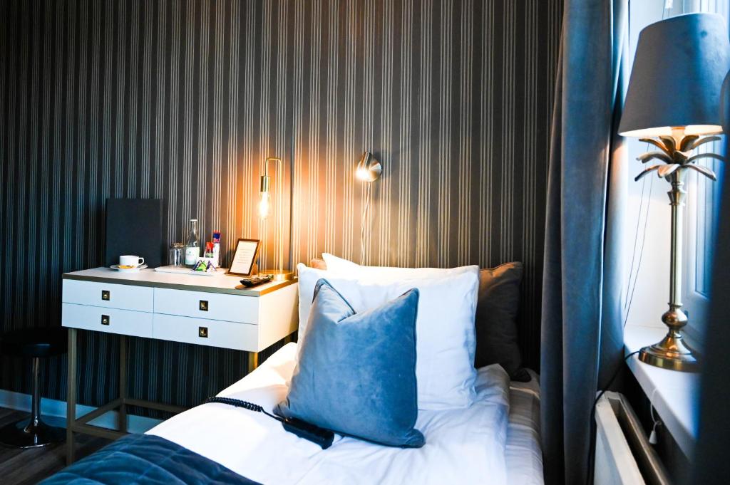 Postel nebo postele na pokoji v ubytování Palace Hotell