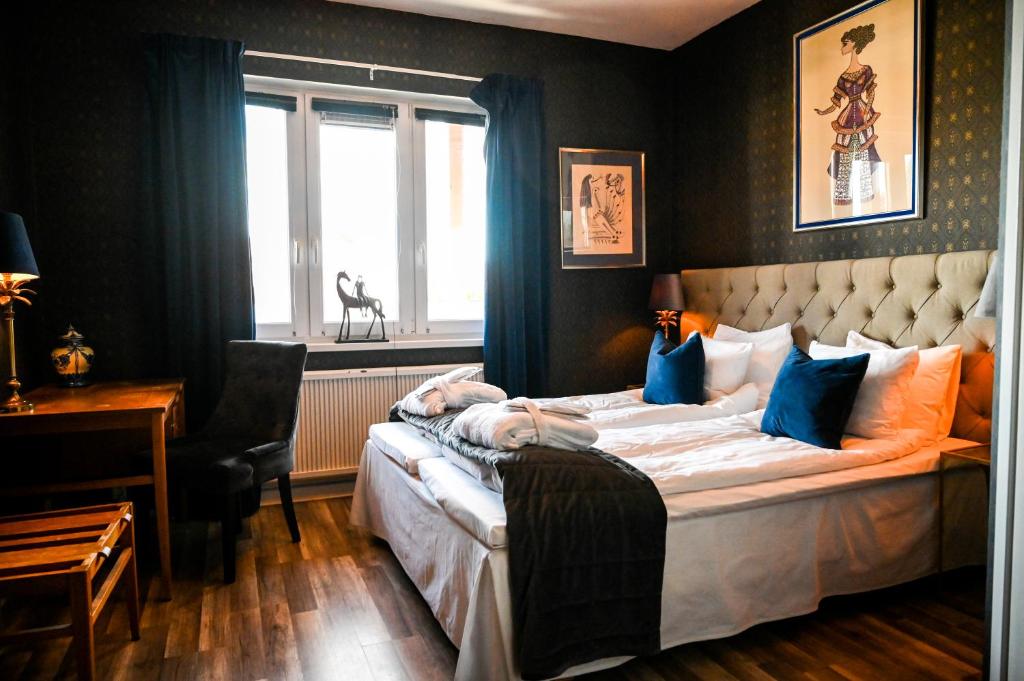 Postel nebo postele na pokoji v ubytování Palace Hotell