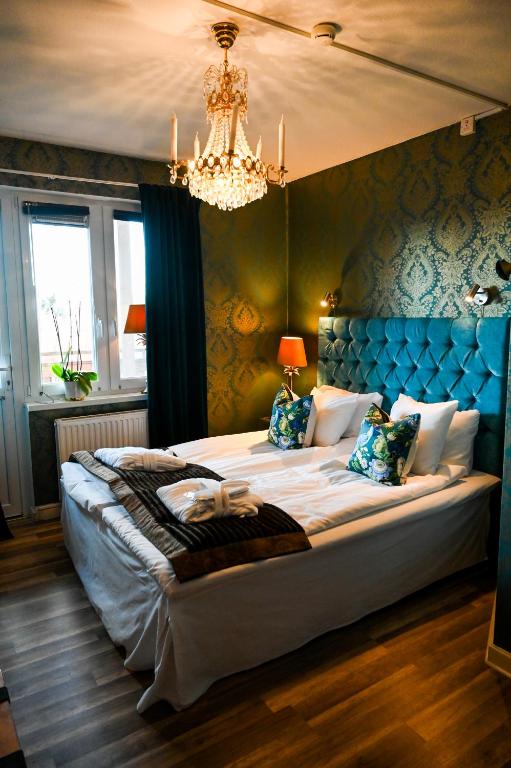 Postel nebo postele na pokoji v ubytování Palace Hotell