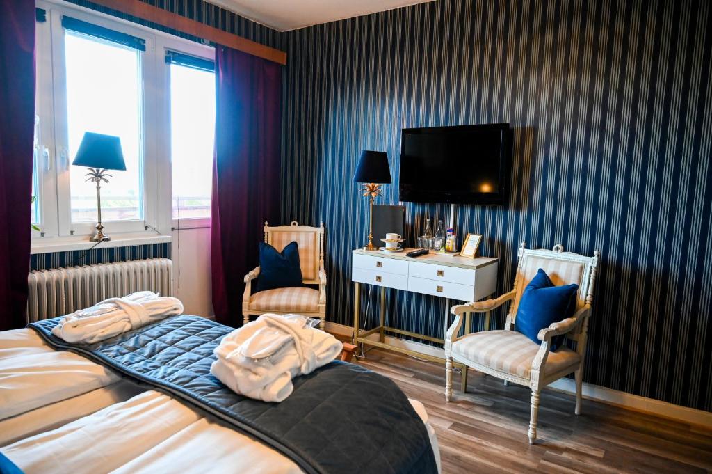 Postel nebo postele na pokoji v ubytování Palace Hotell