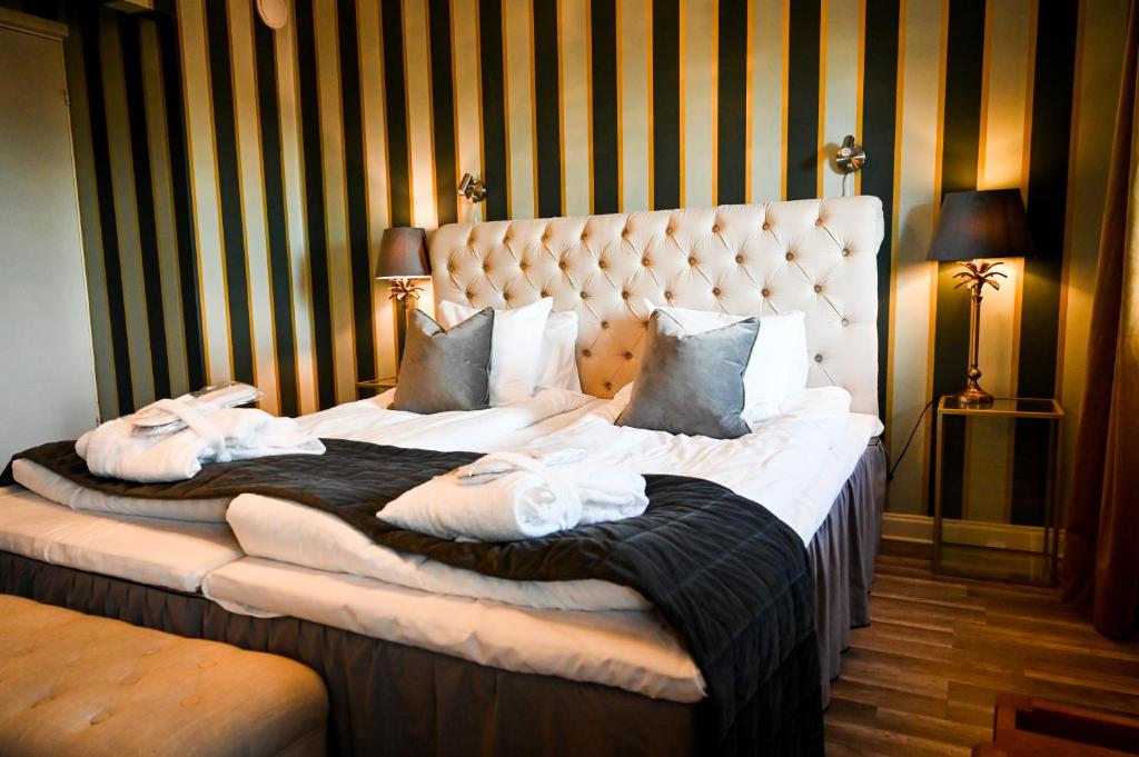 Postel nebo postele na pokoji v ubytování Palace Hotell