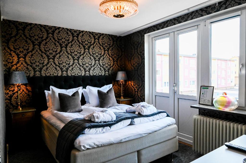 Postel nebo postele na pokoji v ubytování Palace Hotell