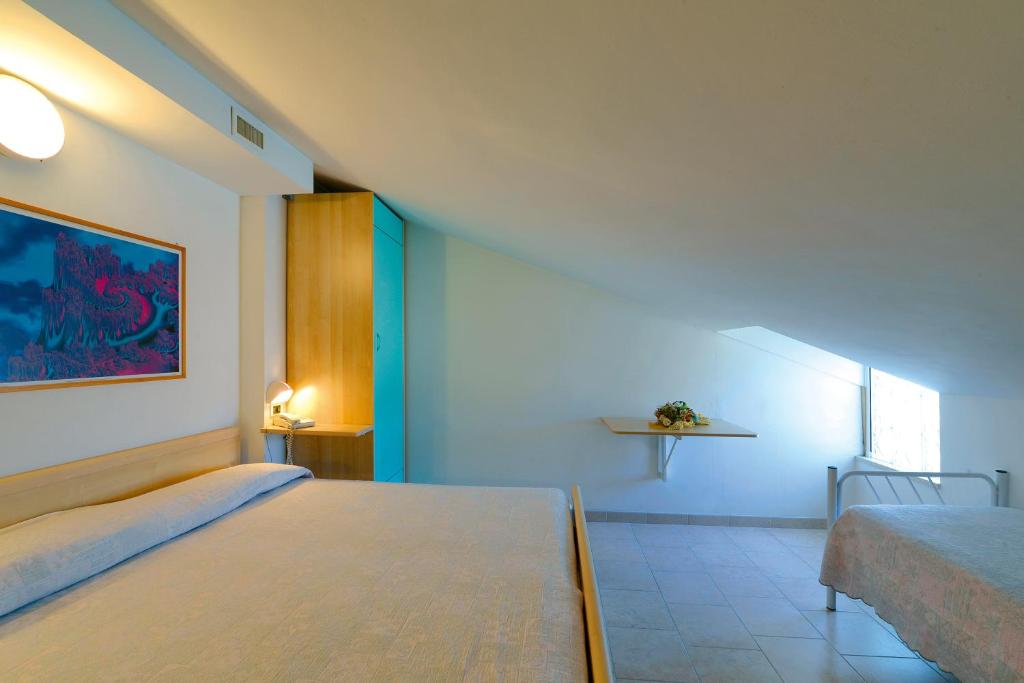Lova arba lovos apgyvendinimo įstaigoje Hotel Residence Margherita