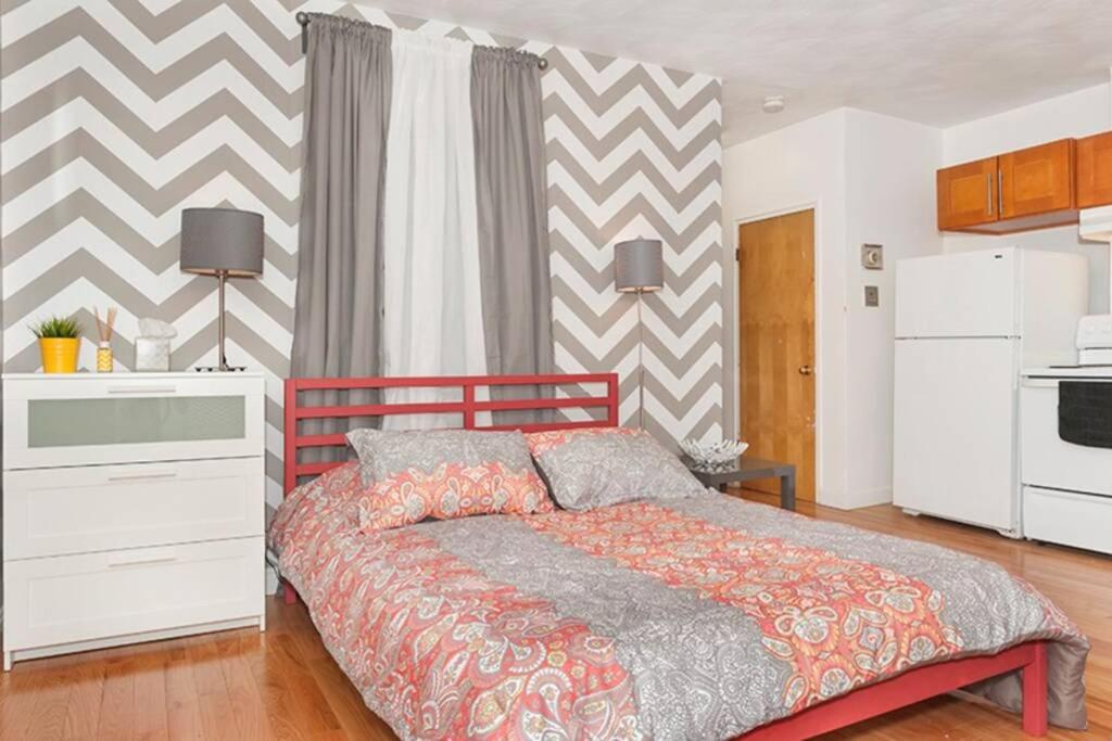 a bedroom with a bed and a white dresser at Downtown Studio Apt, Perfect For Medical Workers in Boston