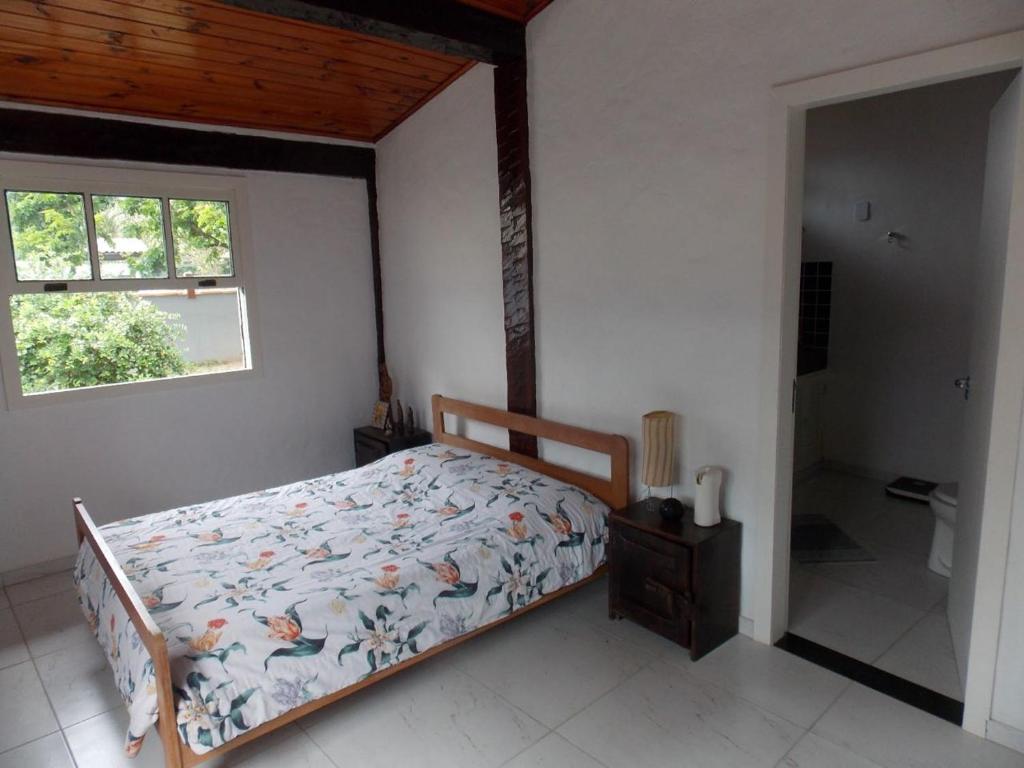 เตียงในห้องที่ Búzios Casa de Família - Bosque de Geribá
